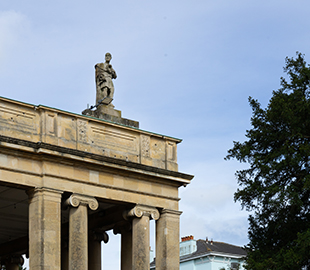 A sculpture of Hippocrates atop Pittville Pump Room Cheltenham